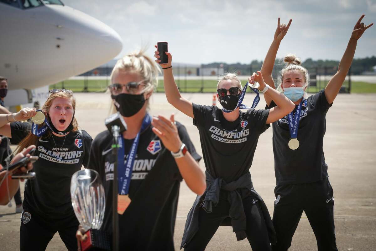 Rachel Daly (front) and Dash teammates (background, from left) Maegan Kelly, Megan Oyster and Kristie Mewis will get a chance to celebrate their NWSL Challenge Cup championship with fans at a drive-thru celebration from 5:30 to 6:30 p.m. Thursday at BBVA Compass Stadium.