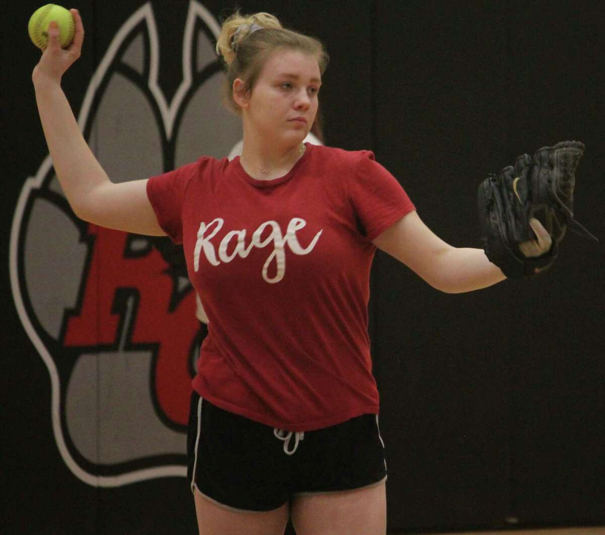 Reed City's Cassie Enos warms up her arm during a preseason softball practice.(Herald Review file photo)