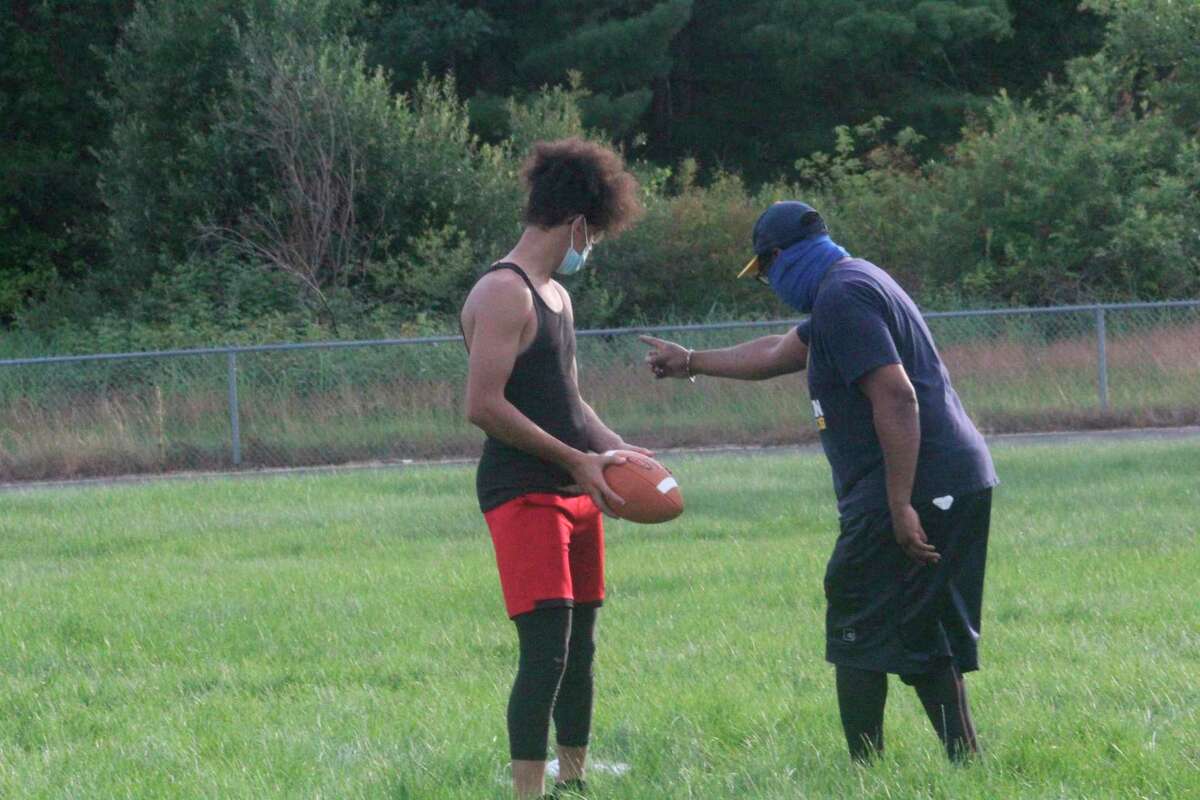 Baldwin's Anthony Austin (left) receives instructions from his dad, Coach Austin, during a workout on Monday. (Star photo/John Raffel)