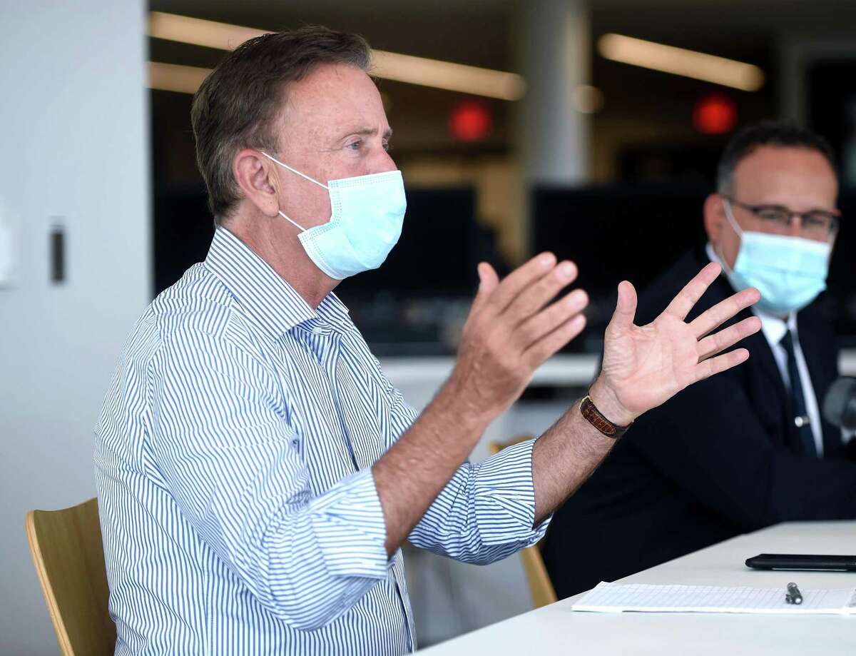 Governor Ned Lamont (left) and Education Commissioner Miguel Cardona (right) meet with students at West Haven High School on July 24, 2020.
