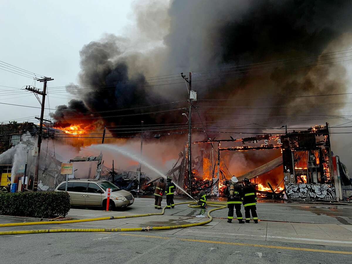 A four alarm fire burns near 14th and Shotwell streets on Tuesday, July 28, 2020 in San Francisco, Calif.