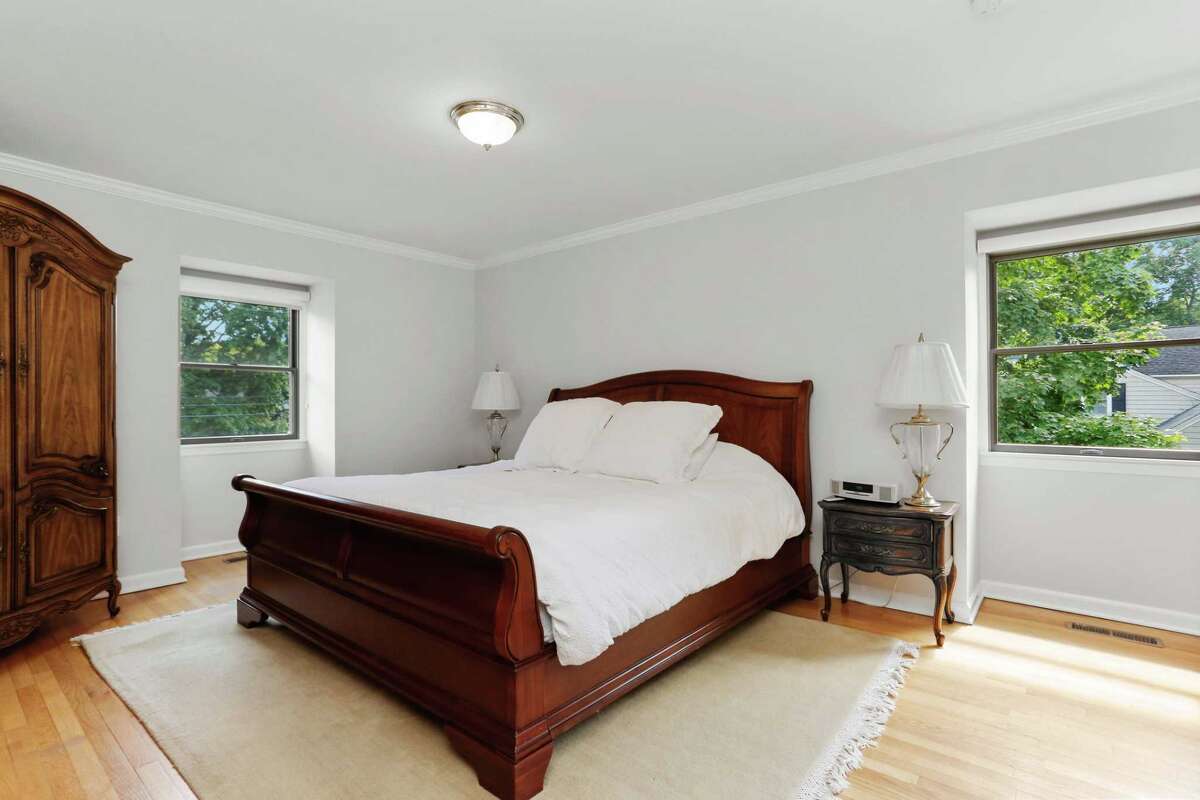 Four bedrooms are found on the second floor. The master suite has a private bath. Four bedrooms are found on the second floor. The master suite has a private bath. The other three bedrooms share a hall bath, which has a long marble vanity with two sinks.