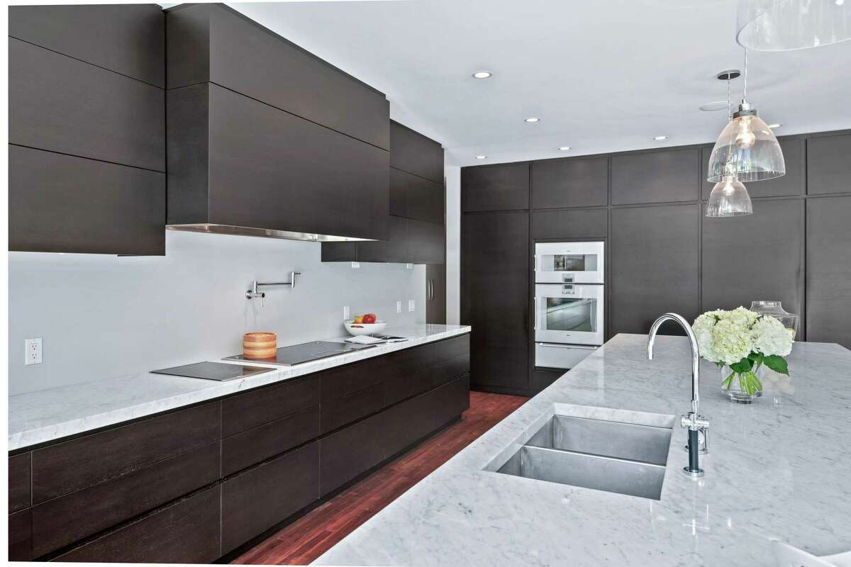 The massive, modern gourmet eat-in kitchen features a 16-foot center island/breakfast bar, quartzite counters, large wine refrigerator, a pot-filler, walk-in pantry, and Gaggenau and Thermador appliances. "This sensational, ultra-chic, entirely customized contemporary presides over two impeccably landscaped acres. ... The contemporary interpretation with impeccable function and fluidity makes this home a destination," according to the listing agent. Despite its size - 14 rooms and 11,853 square feet of living space on four finished levels - this house was built in 2010 with energy efficiency in mind. This Energy Star-rated house features extra insulation, a programmable thermostat, and Thermopane windows. Although the municipally owned Longshore Club Park is only a short distance away, the owners of this property need only walk out to their two-acre grounds to enjoy its heated Gunite in-ground swimming pool, pool house and tennis court. For leisurely walks, there is Winslow Park less than a mile away at the corner of Compo Road North and Post Road (Route 1).