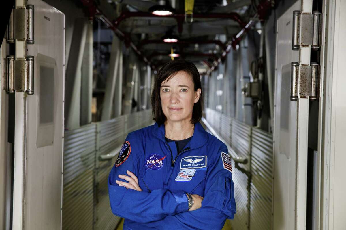NASA astronaut Megan McArthur poses for a portrait on the Crew Access Arm of the mobile launcher, Tuesday, June 25, 2019, inside the Vehicle Assembly Building at NASA's Kennedy Space Center in Florida.