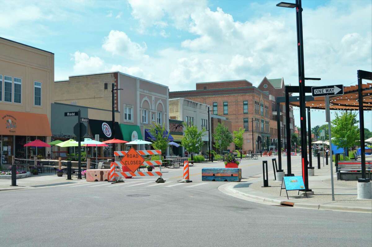 Painted barricades and road signs physically close off two blocks of Main Street in downtown Midland -- between Ashman and Rodd streets -- as a way to allow businesses to expand and allow for room to social distance on July 26, 2020. (Ashley Schafer/ashley.schafer@hearstnp.com)
