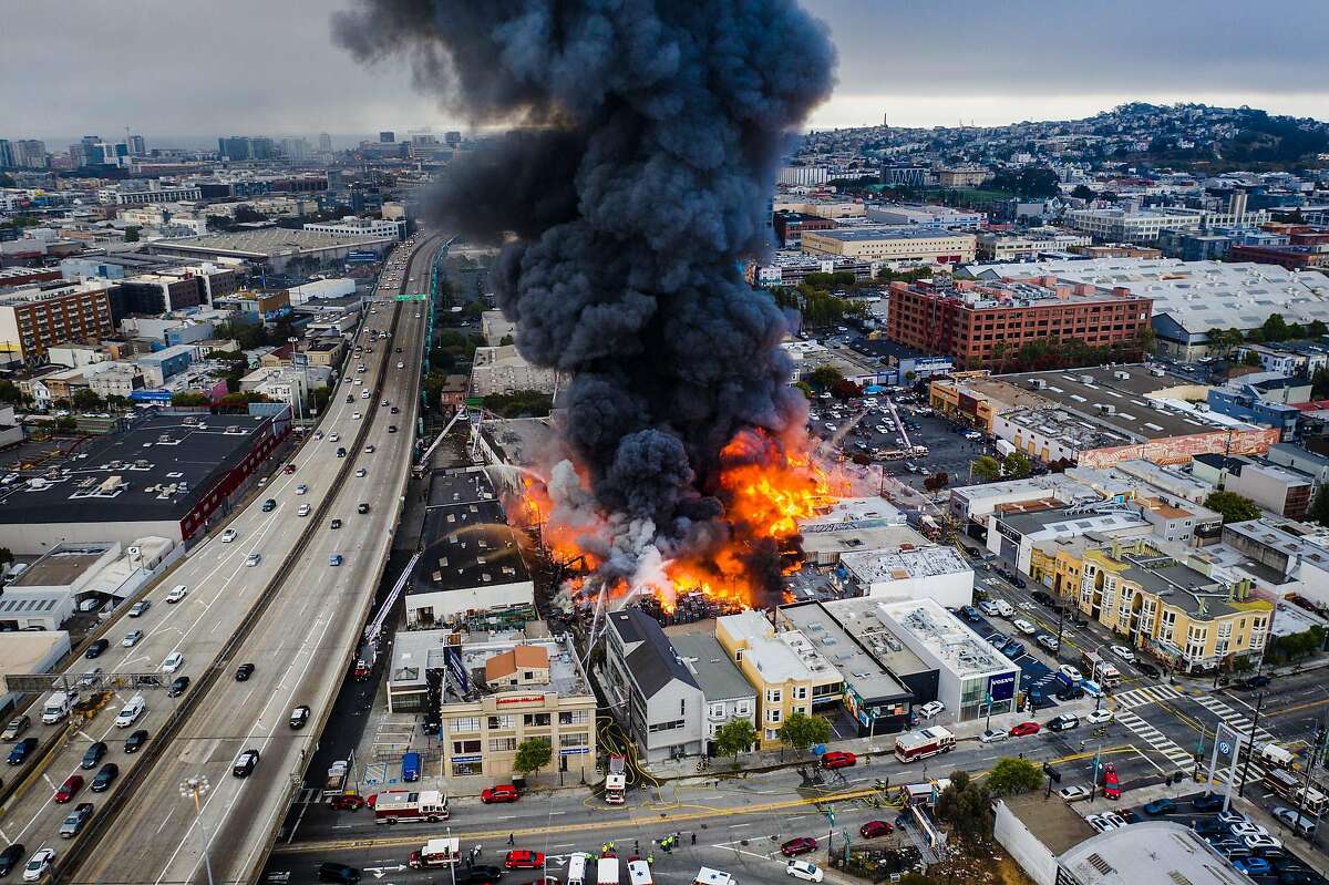 A large structure fire spread to multiple buildings near 13th and Shotwell streets on Tuesday, July 28, 2020 in San Francisco, Calif.
