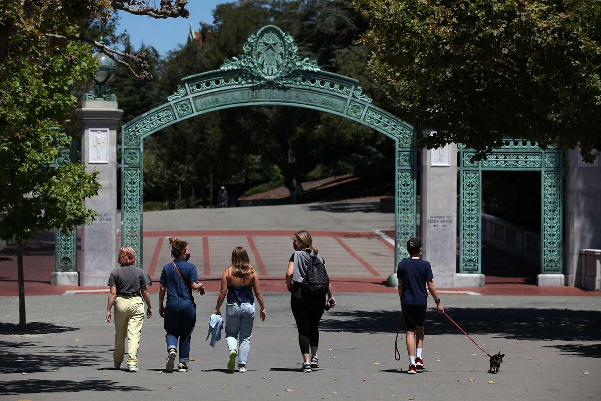 People walk toward Sather Gate on the UC Berkeley campus on July 22, 2020 in Berkeley, Calif.