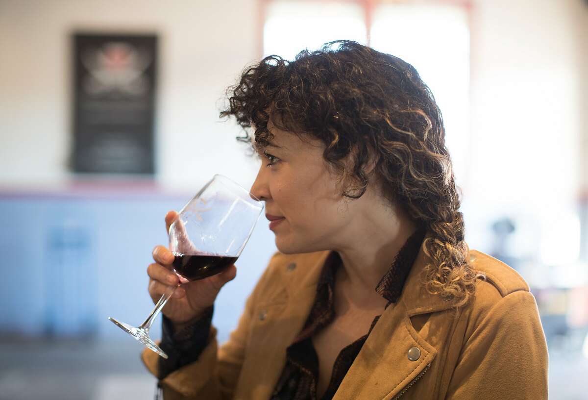 Suzanne Plucinski tastes wine at Treasure Island Winery on Saturday, Nov. 24, 2018, in Treasure Island, Calif.