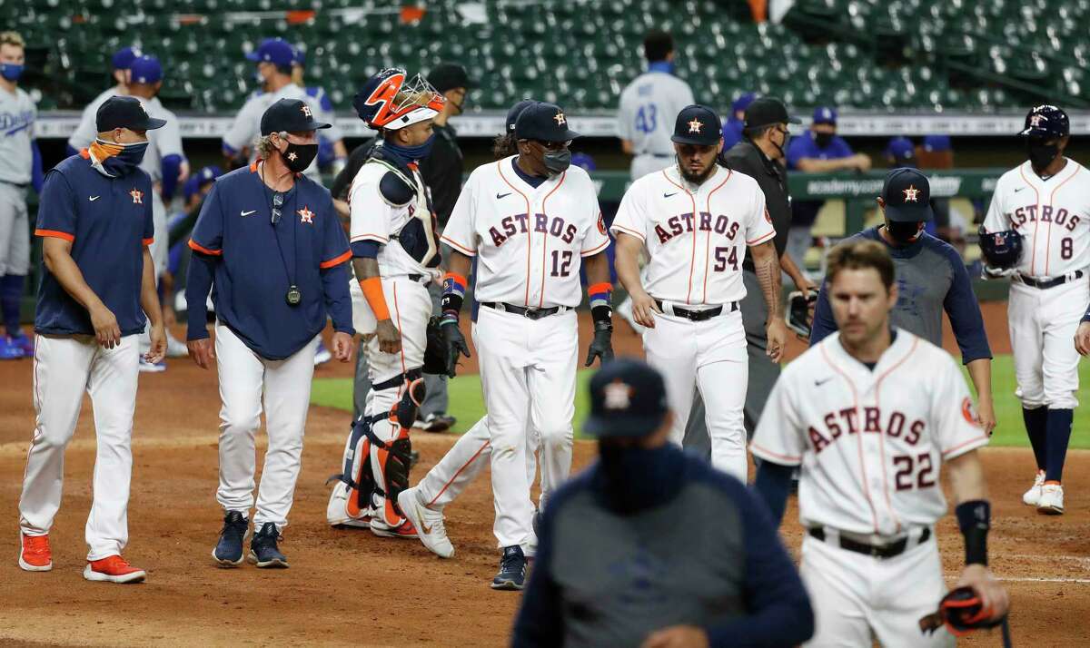 Houston Astros manager Dusty Baker walks back to the dugout after both benches were cleared after Houston Astros Carlos Correa and Los Angeles Dodgers relief pitcher Joe Kelly confronted each other during the sixth inning of an MLB baseball game at Minute Maid Park, Tuesday, July 28, 2020, in Houston.