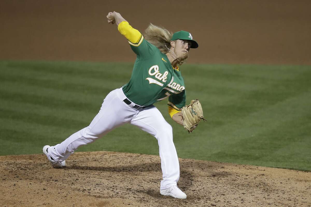Oakland Athletics pitcher Jordan Weems works against the Colorado Rockies in the fifth inning of a baseball game Tuesday, July 28, 2020, in Oakland, Calif. (AP Photo/Ben Margot)