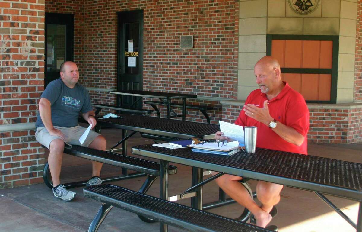 Sen. Curt VanderWall met with constituents during his monthly coffee hour in Reed City on July 20. Among the issues addressed during the meeting was plans for reopening schools in the fall. Trinity Lutheran School Principal Rich Saladin joined the discussion. (Herald Review photo/Cathie Crew)