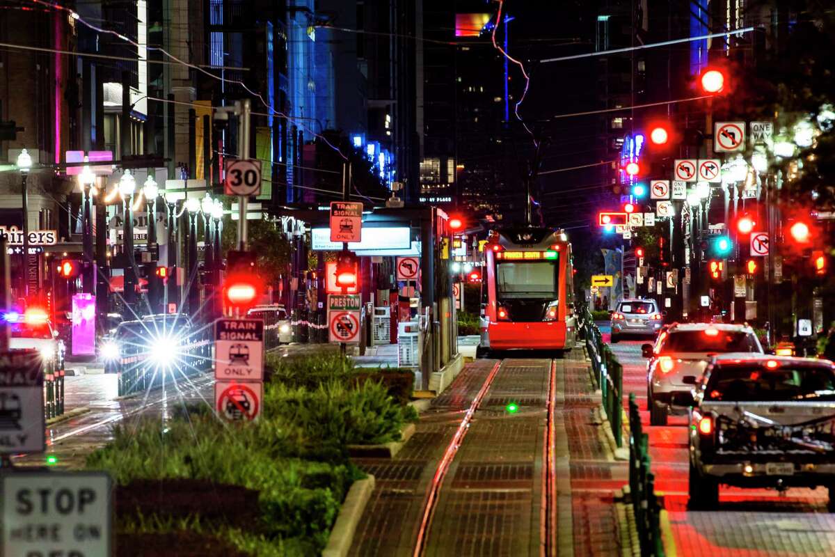 A Metropolitan Transit Authority light rail train travels along Main Street on July 28, 2020, in downtown Houston. City and downtown officials, spurred by some bar owners and restaurateurs, are working on possible plans to use Main Street for outdoor dining.