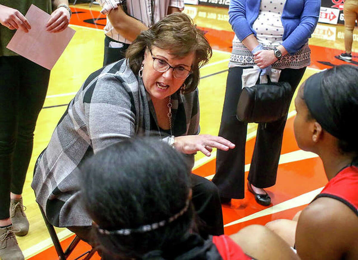 SIUE coach Paula Buscher talks to her Cougars during a timeout during a regular-season game at First Community Arena in Edwardsville.