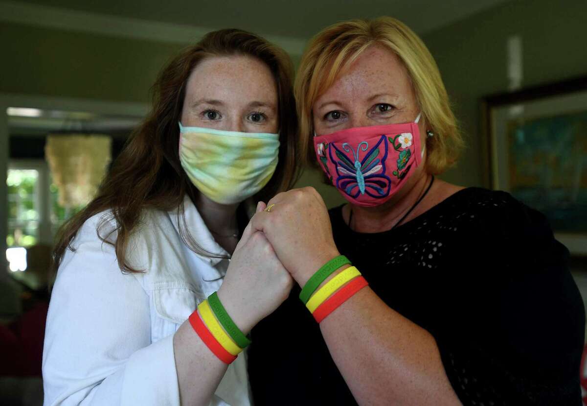 My Covid Color social distancing wristband entrepreneurs Amy, left, and Liz Smith at their home in Norwalk, Conn. on Monday, July 27, 2020.