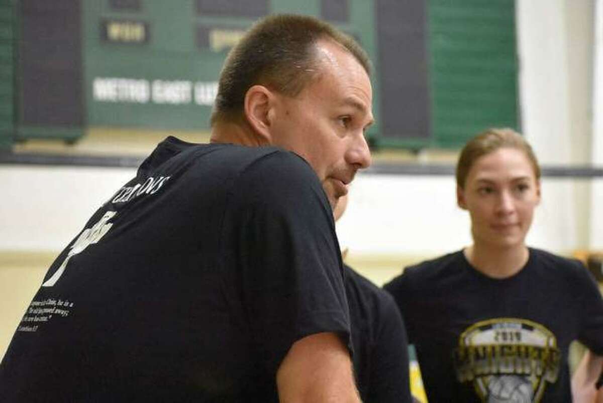 Metro-East Lutheran girls volleyball coach Jon Giordano talks to his team during a practice last summer.