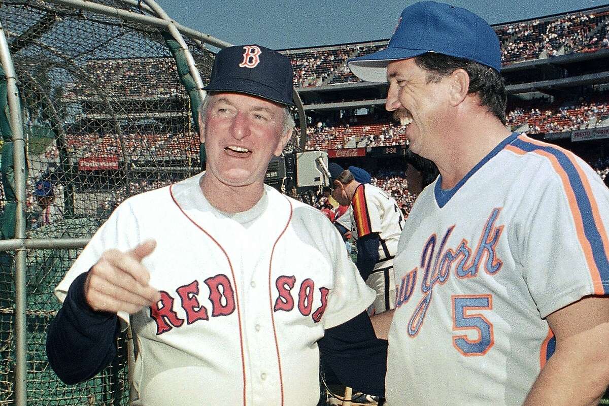 FILE - In this July 13, 1987, file photo, American League All-Star manager John McNamara, left, of the Boston Red Sox, chats with National League counterpart Davey Johnson, of the New York Mets, between workouts in preparation for the upcoming All-Star Game in in Oakland, Calif. McNamara, who managed several Major League Baseball teams during his career, died Tuesday, July 28, 2020, in Tennessee. He was 88. (AP Photo/Paul Sakuma, File)