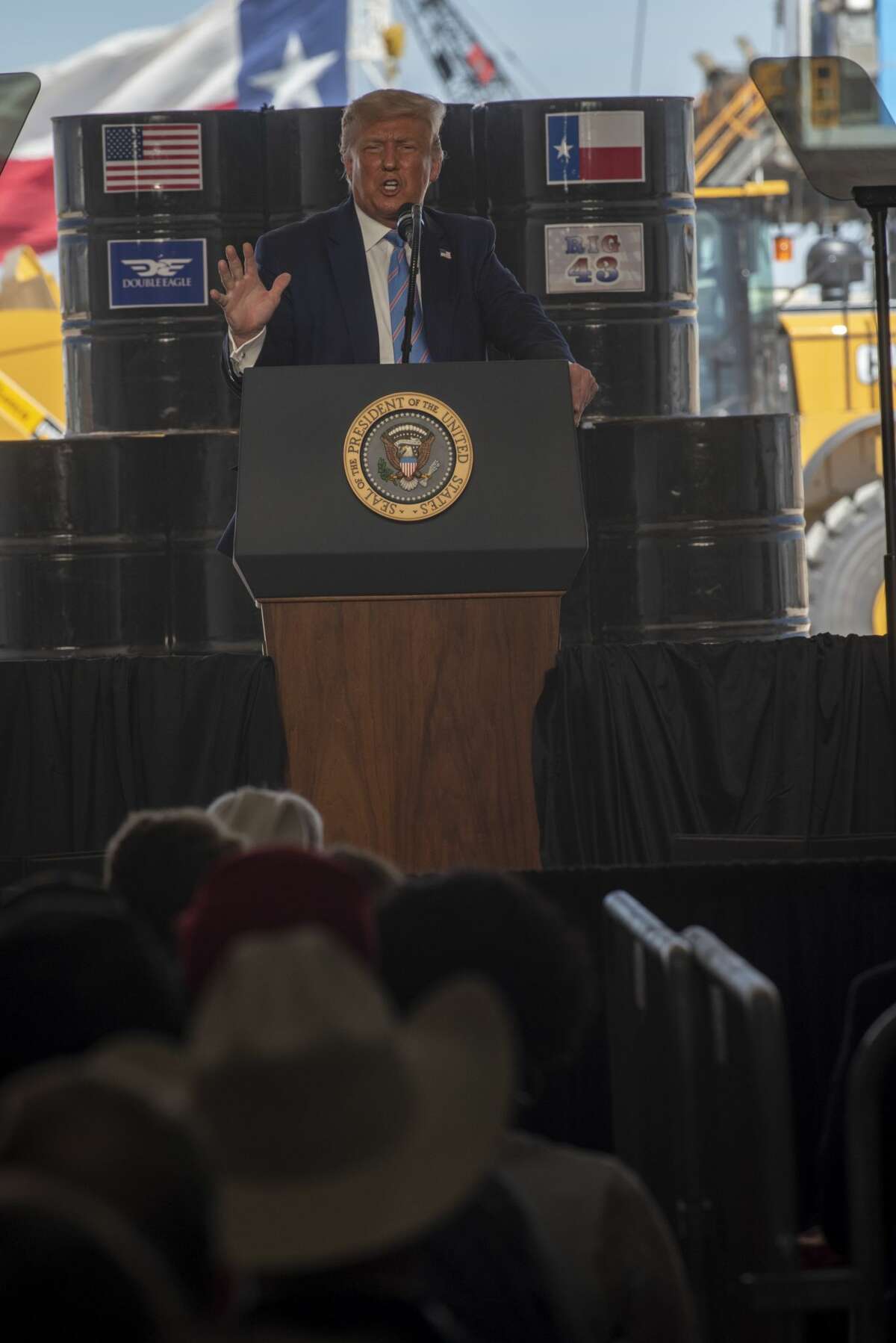 President Donald Trump talks to a crowd at a Double Eagle Energy oil and gas operation in front of Latshaw Rig No. 43 on Wednesday, July 29, 2020 in Midland County. Jacy Lewis/Reporter-Telegram