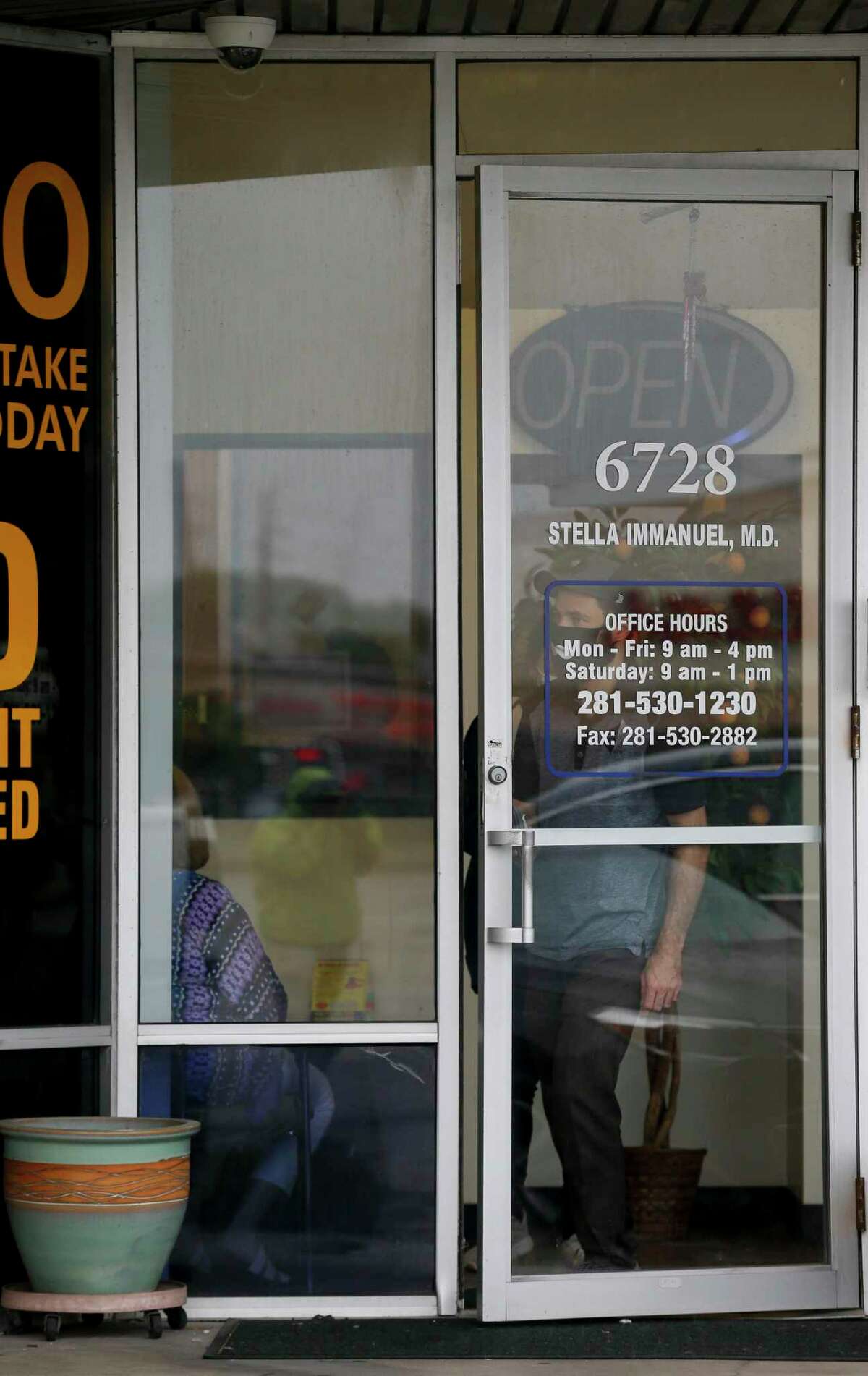 A person walks out of the clinic operated by Stella Grace Immanuel, a licensed medical practitioner and preacher with the Fire Power Ministries church, at The Commons at Mission Bend shopping mall Wednesday, July 29, 2020, in Houston.