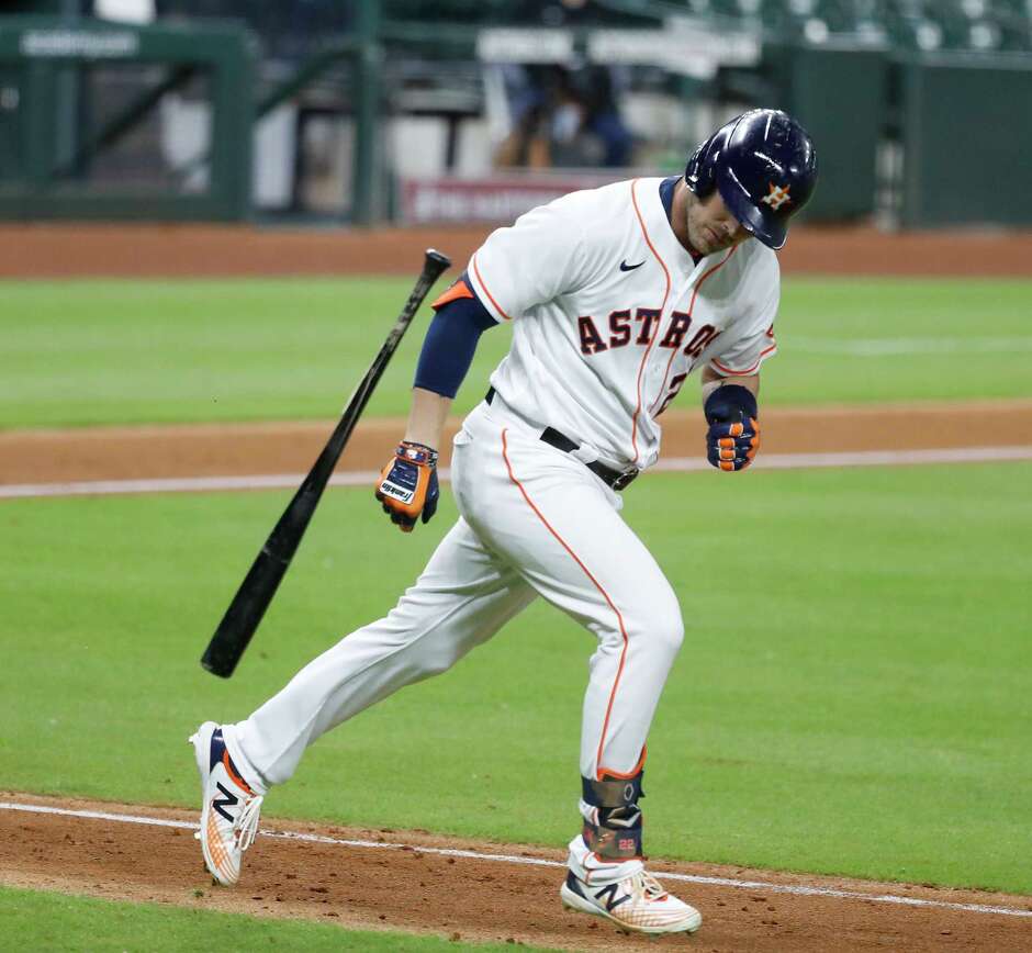 Houston Astros Josh Reddick throws his bat in frustration as he popped out to Los Angeles Dodgers shortstop Corey Seager during the sixth inning of an MLB baseball game at Minute Maid Park, Wednesday, July 29, 2020, in Houston.