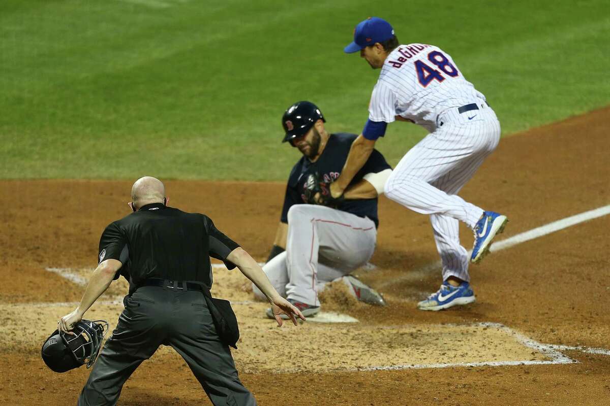 NEW YORK, NEW YORK - JULY 29: Mitch Moreland #18 of the Boston Red Sox scores on Jacob deGrom #48 of the New York Mets wild pitch in the fourth inning at Citi Field on July 29, 2020 in New York City. (Photo by Mike Stobe/Getty Images)