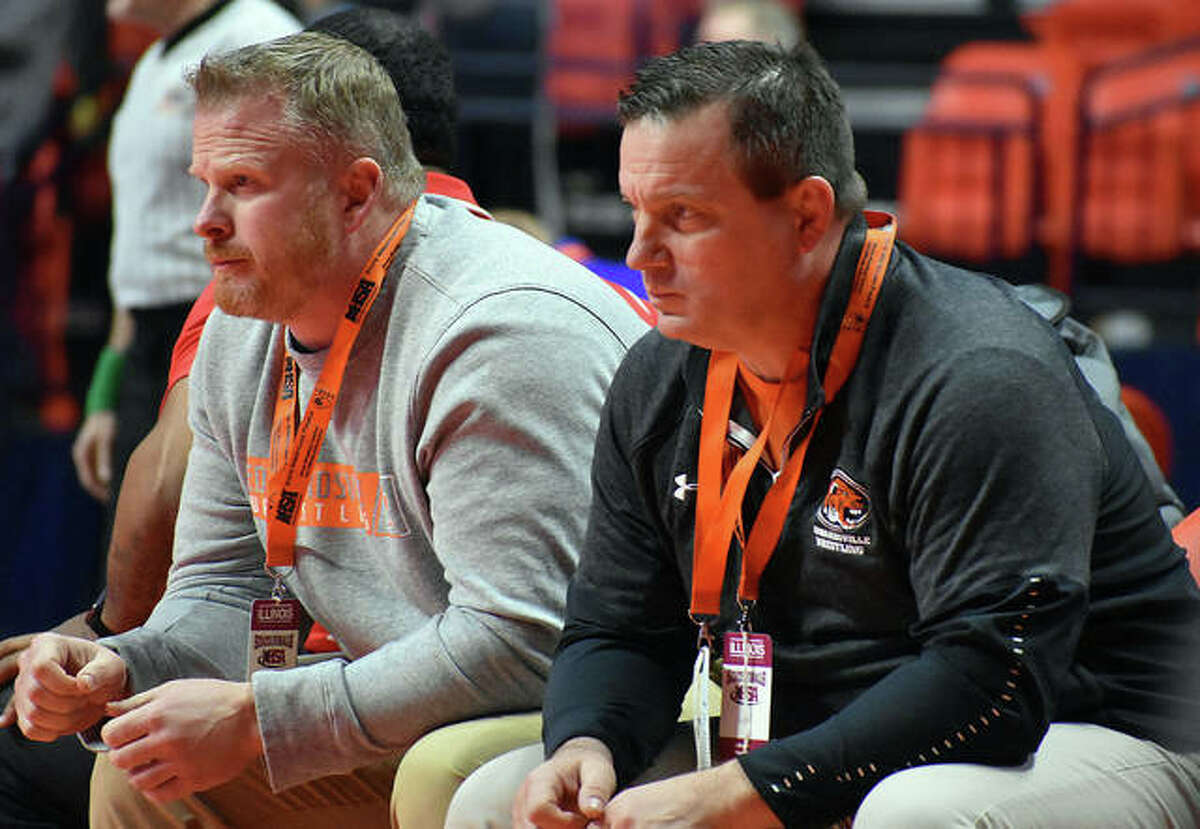 Edwardsville coach Jon Wagner, shown watching one of his wrestlers with assistant coach Doug Heinz at the Class 3A state meet in Champaign, is the 2020 Telegraph Wrestling Coach of the Year.