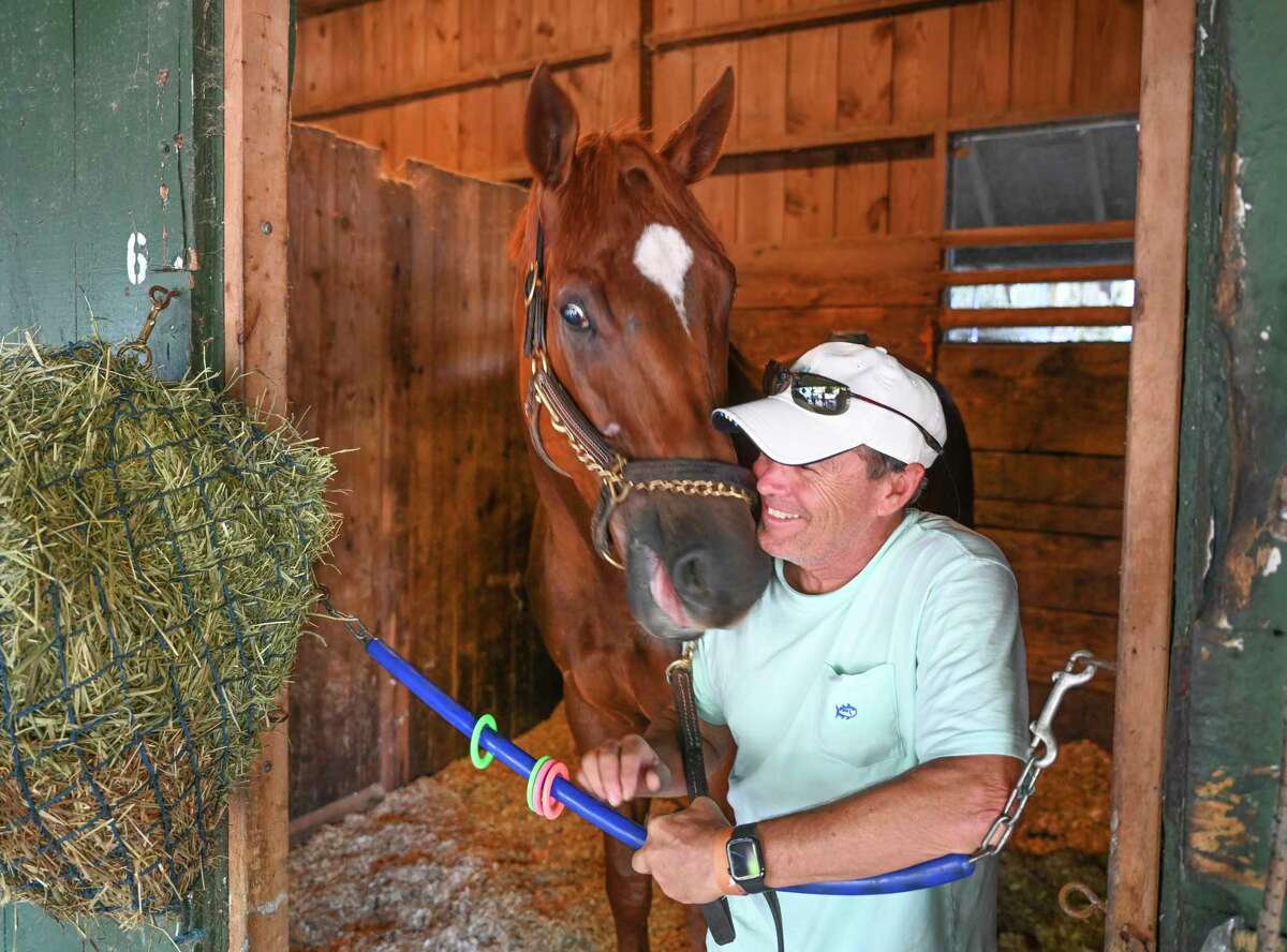 Trainer John Kimmel share a quiet moment with Whitney entrant Mr. Buff in the barn area at the Saratoga Race Course Thursday July 30, 2020 in Saratoga Springs, N.Y. Photo by Skip Dickstein/Special to the Times Union