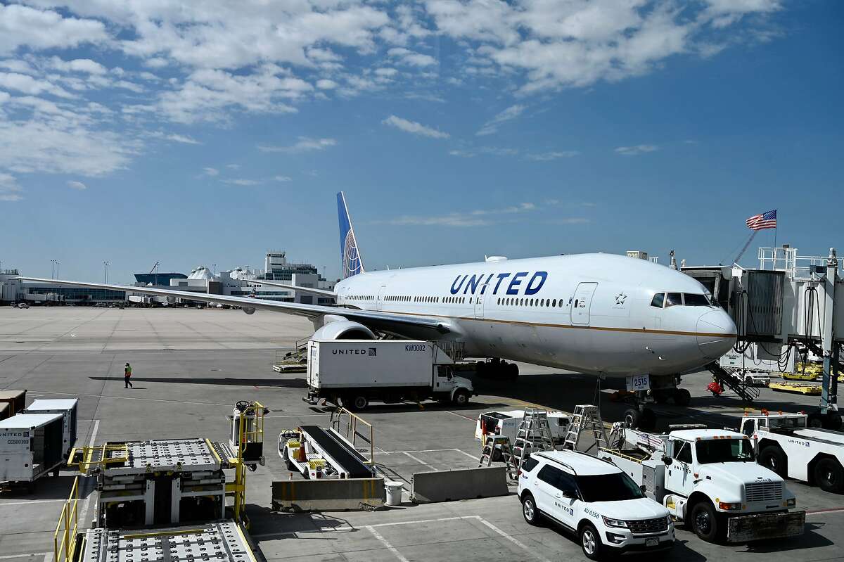 In this photo a Boeing 777/200 of United Airlines is seen at the gate at Denver International Airport (DIA) on July 30, 2020, in Denver, Colorado. Imagine, if you will, that you’re stuck in a metal box filled with recirculated air for 11 hours, travelling at 500 miles per hour, 38,000 feet above the ground. Now, imagine that the person two rows over has contracted a virus — any virus — the flu, perhaps, or maybe (oh, I don’t know) COVID-19. They don’t have any symptoms. No headache, no cough, no temperature, no body aches. What are the chances you’re going to catch that virus?