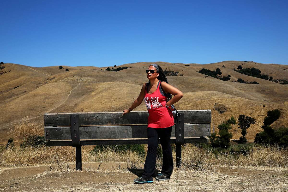 Tiffany Black, 40, poses for a portrait at Garin Regional Park on Wednesday, July 29, 2020, in Hayward, Calif. With coronavirus cases surging and the future of unemployment benefits still up for debate in Congress, over a million Americans are still expected to file for unemployment this week. Tiffany was just laid off from Airbnb, but is using the time to refocus and reconsider what she wants to be spending her time on. She's been reading a lot, connecting with others who've been laid off from Airbnb, writing and applying to grad school.