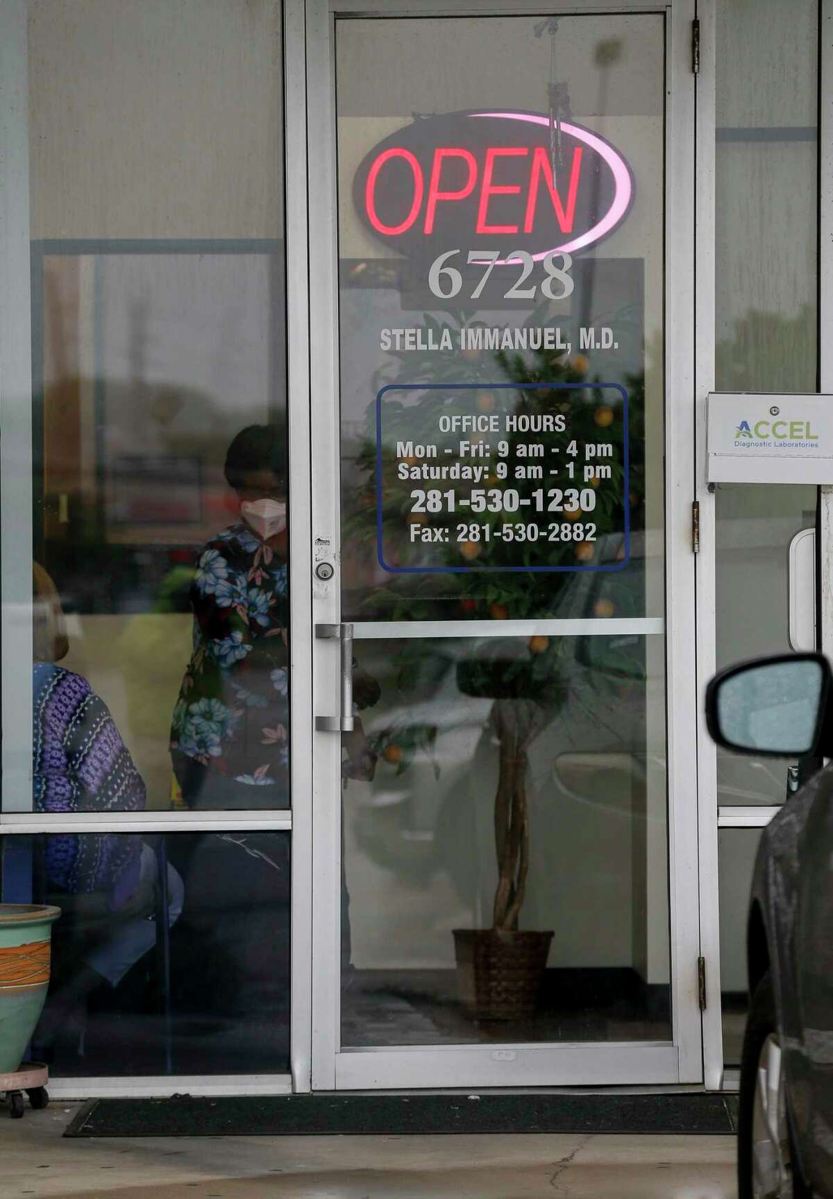 A person walks out of the clinic operated by Stella Grace Immanuel, a licensed medical practitioner and preacher with the Fire Power Ministries church, at The Commons at Mission Bend shopping mall Wednesday, July 29, 2020, in Houston.