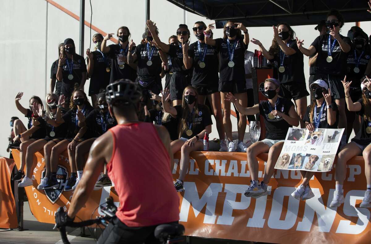 Houston Dash fans elebrate the team's NWSL Challenge Cup Championship at a drive-thru setting Thursday, July 30, 2020, outside BBVA Stadium in Houston.