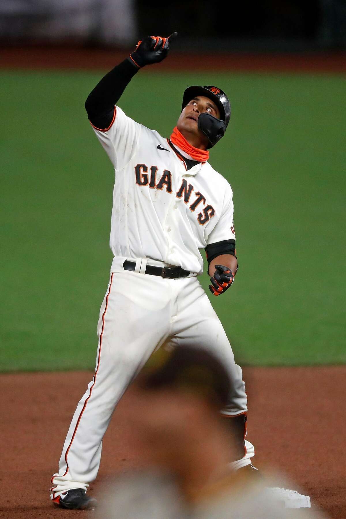 San Francisco Giants' Donovan Solano reacts to his RBI double in 7th inning against San Diego Padres during MLB game at Oracle Park in San Francisco, Calif., on Thursday, July 30, 2020.