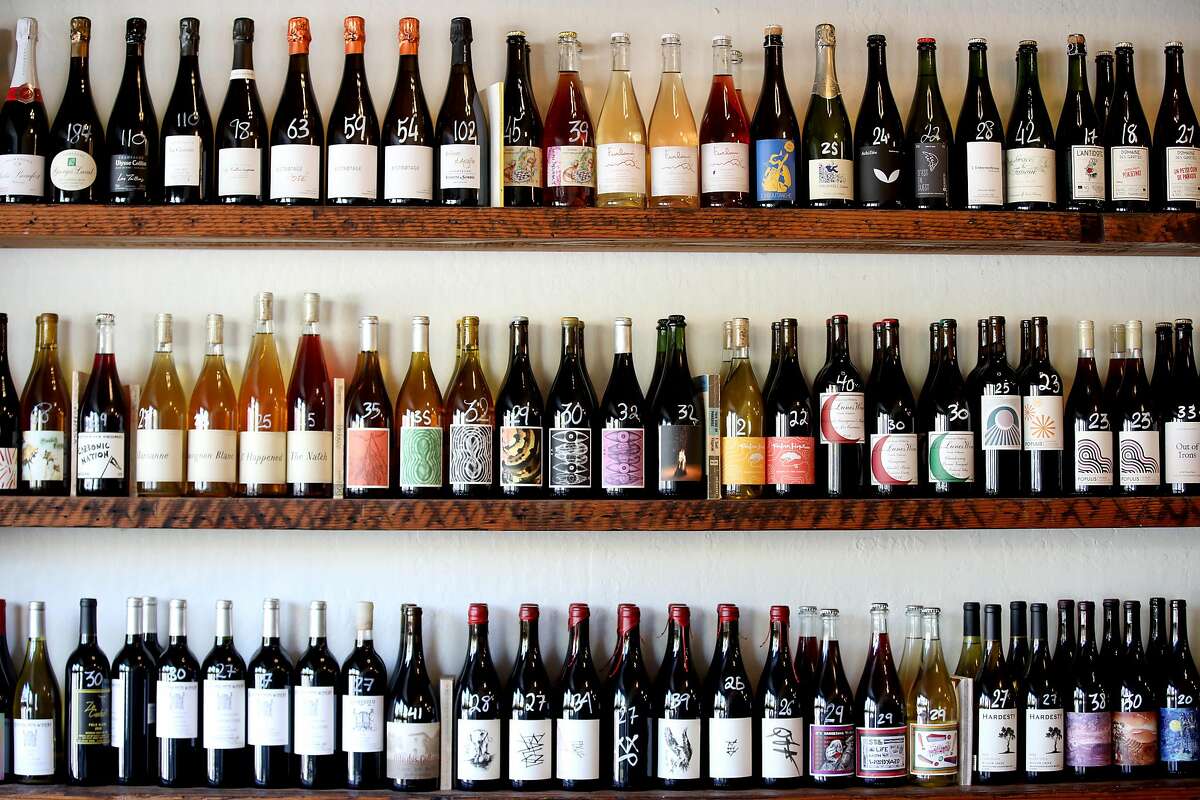 A variety of wines sit on shelves at Ordinaire Wine Shop and Wine Bar, located at 3354 Grand Ave., on Friday, July 10, 2020, in Oakland, Calif. Jirka Jireh, a manager and sommelier at Ordinaire Wine Shop and Wine Bar, has begun organizing virtual wine classes for BIPOC across the country; the classes are free for all students, with the instructor donating time and wine companies donating all the wine.