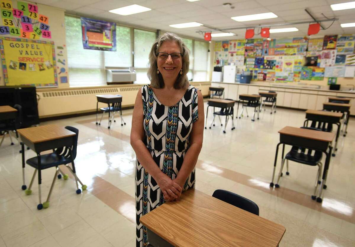 Lisa Lanni, head of school and principal at Holy Trinity Catholic Academy, in one of the school's socially distanced classrooms in Shelton, Conn. on Thursday, July 30, 2020. The school is opening on August 31 for in person instruction five days a week.