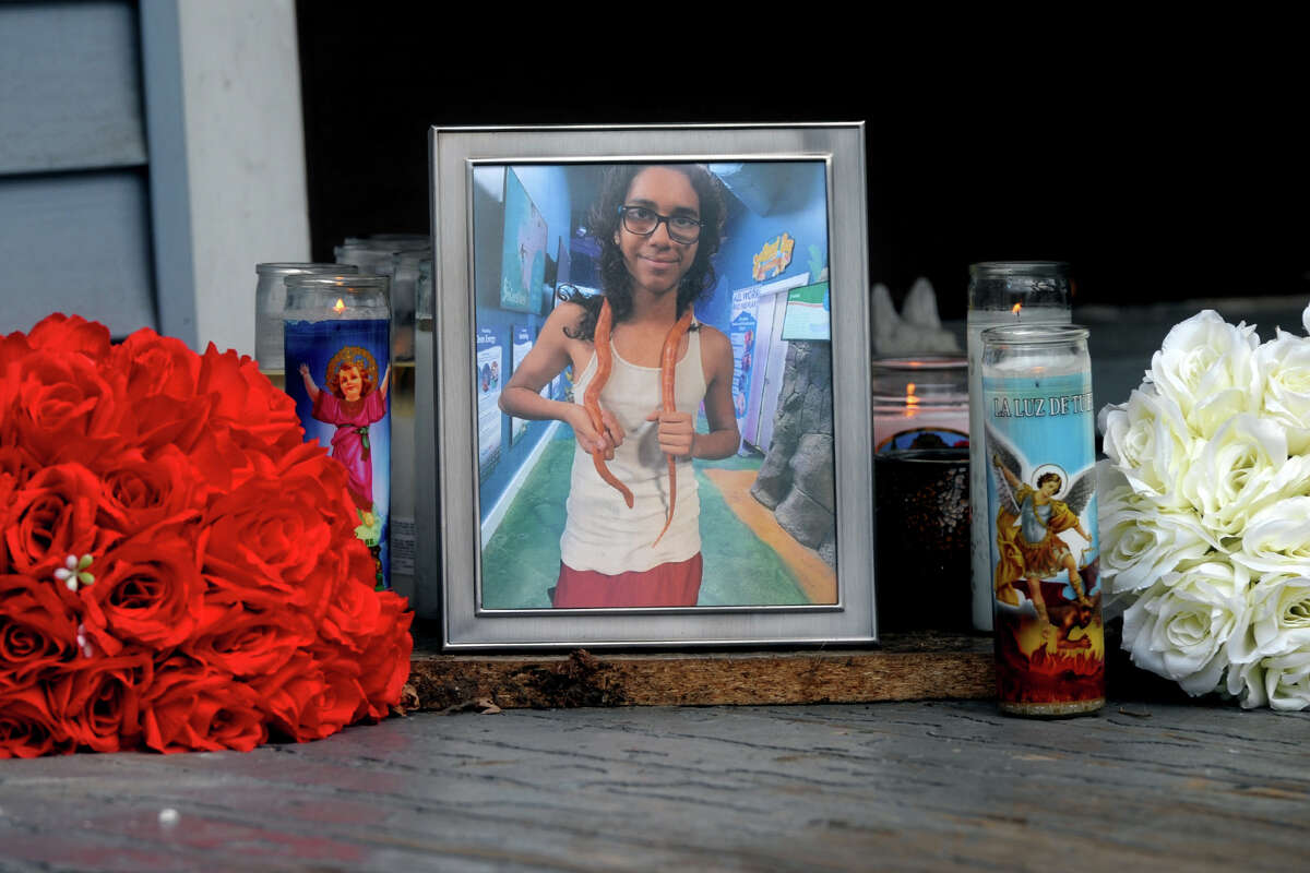 A memorial set up on the front porch of a home in memory of Jose Nunez, in Bridgeport, Conn. July 31, 2020.