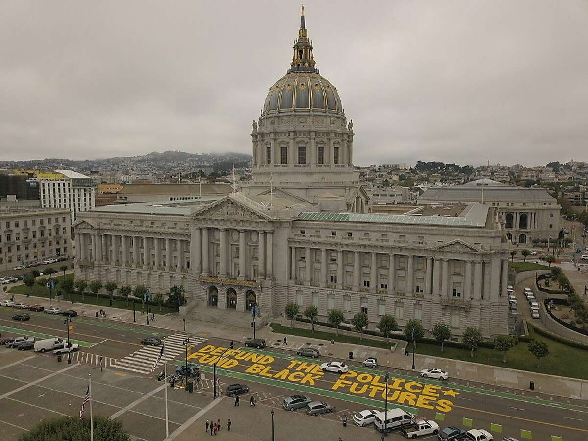 A mural reading Defund the Police Fund Black Futures is seen on Dr. Carton B, Goodlet Place next to San Francisco City Hall on Monday, July 20, 2020 in San Francisco, Calif.