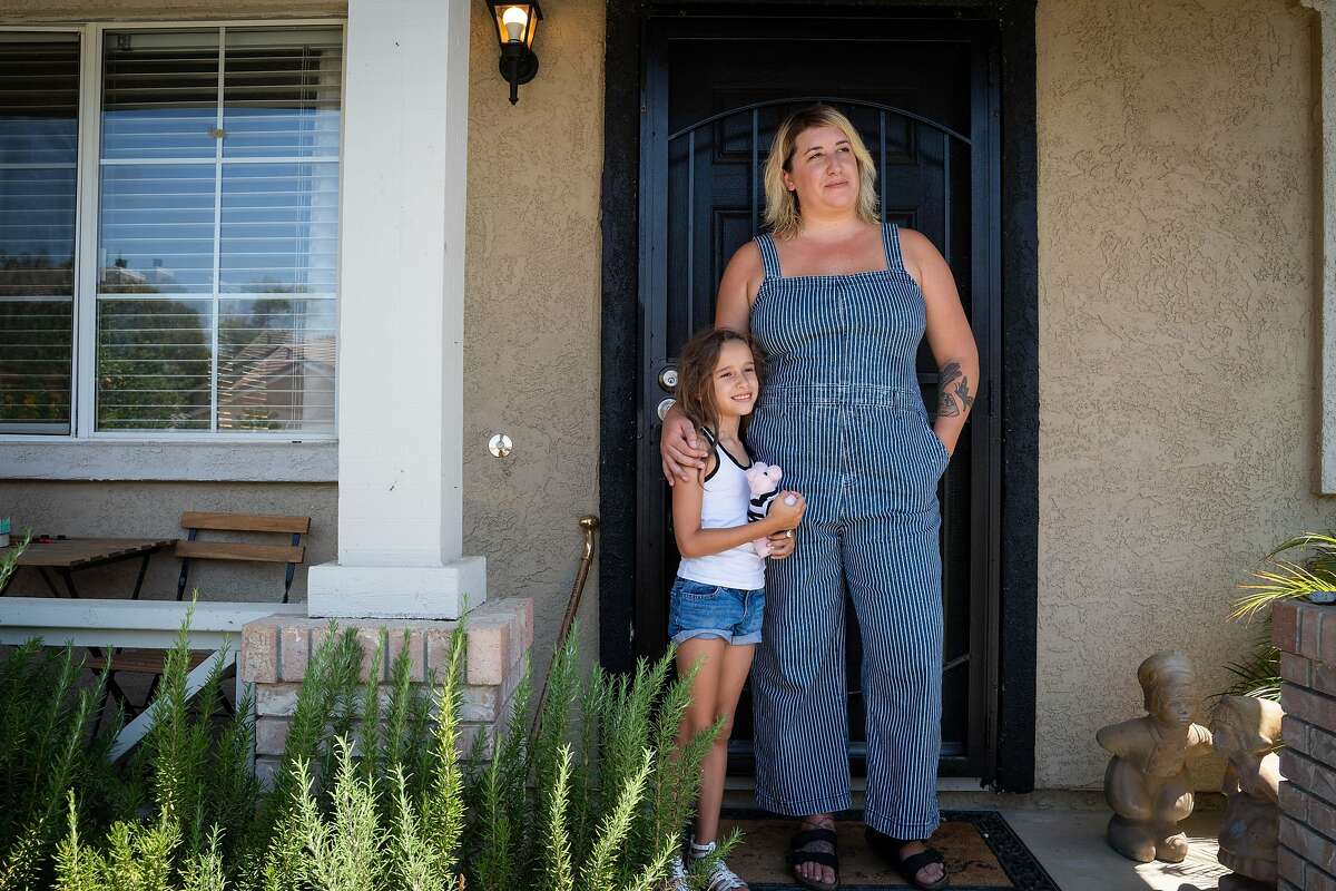 Delilah Lancaster, 6, left, and her aunt, Kristina Lancaster, 31, pose for a photo at Kristina's brother's home in Brentwood, Calif., on Monday, July 27, 2020. After losing work as a hair stylist due to the coronavirus pandemic, it took four months until Lancaster received any of her unemployment benefits. Lancaster plans to stay with family and friends in Brentwood, San Francisco and Oregon over the coming months.