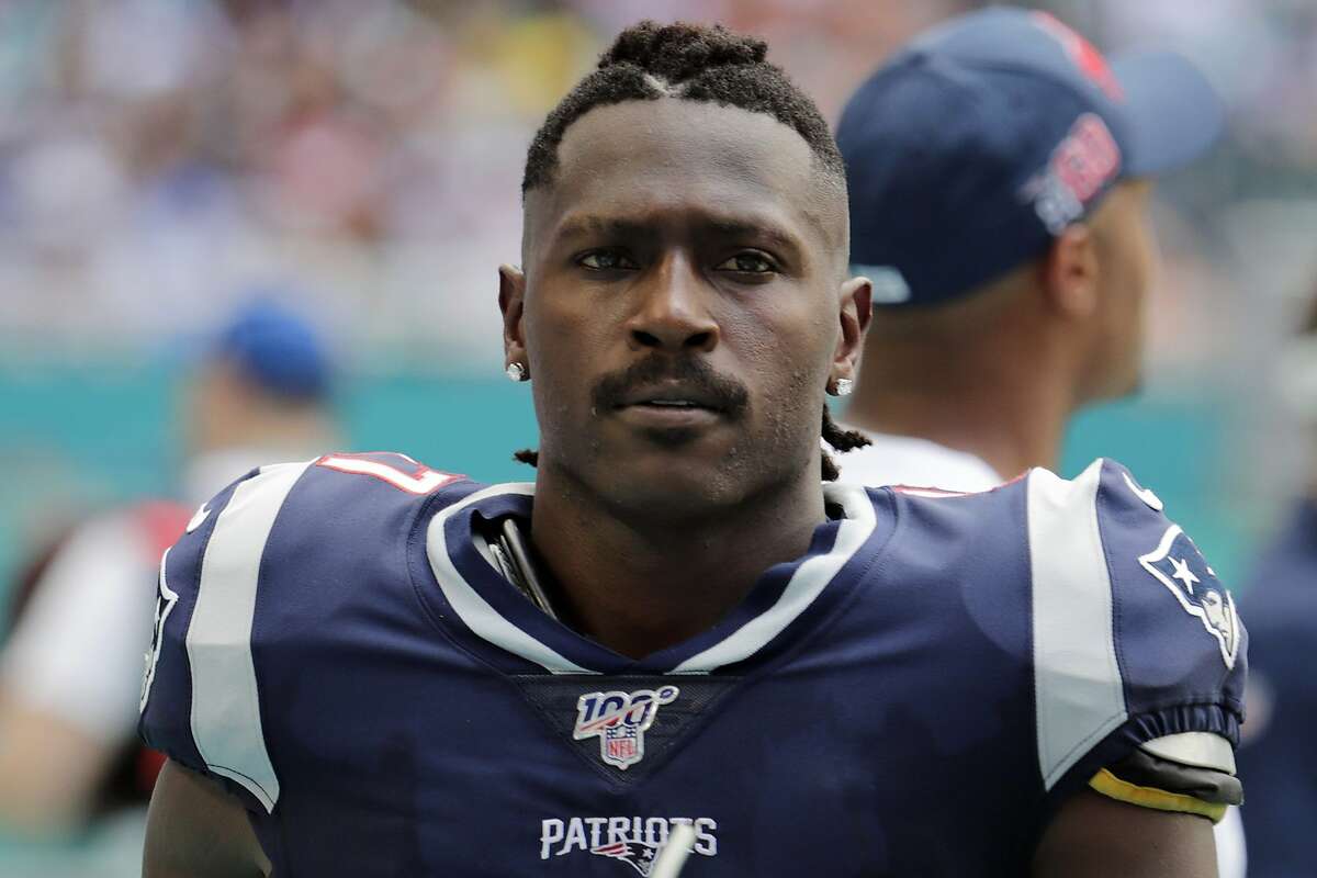 FILE - In this Sept. 15, 2019, file photo, New England Patriots wide receiver Antonio Brown (17) watches on the sidelines during the first half at an NFL football game against the Miami Dolphins in Miami Gardens, Fla. The NFL has suspended Brown for the first eight regular-season games of the 2020 season Friday, July 31, 2020, under the league’s personal conduct policy. Brown does not have a contract with any team. (AP Photo/Lynne Sladky, File)