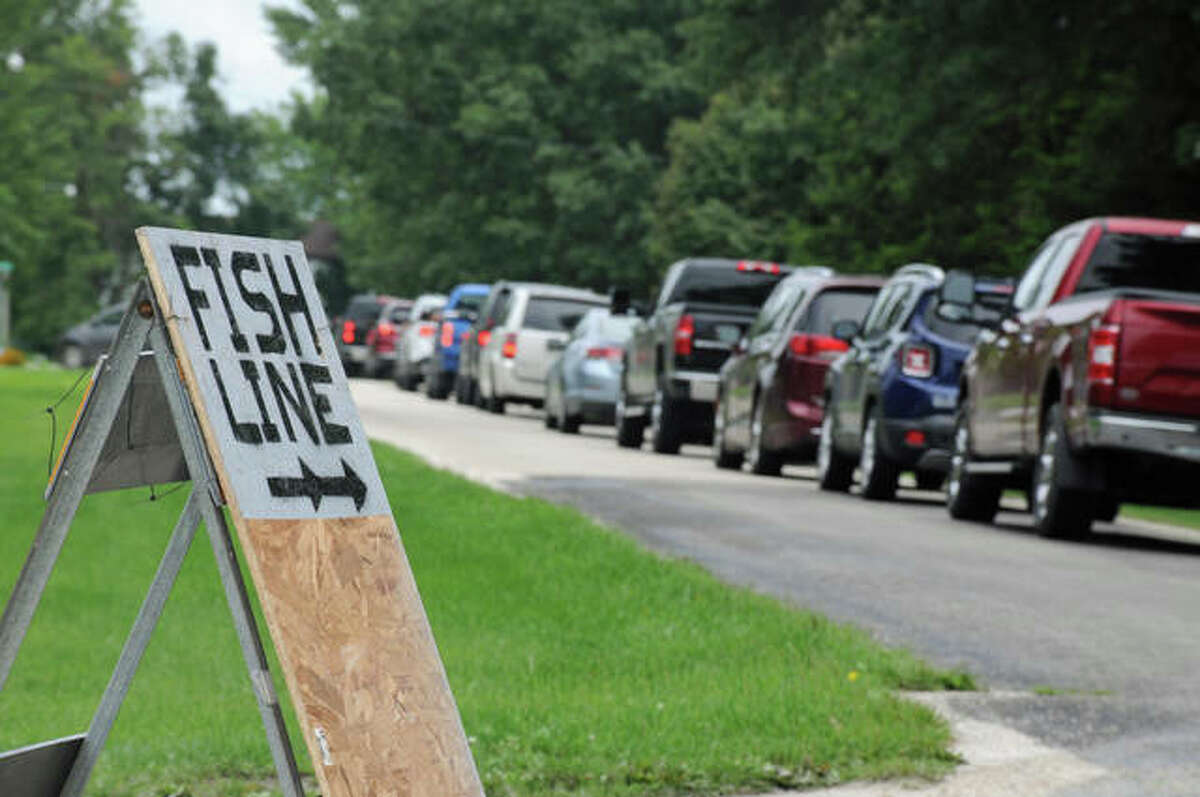 Signs posted throughout Dorchester directed the long line of vehicles to the fish fry drive-through service. Although the community’s annual homecoming was canceled this year, the Dorchester Volunteer Fire Department opted to continue its annual fish fry as a drive-through service.