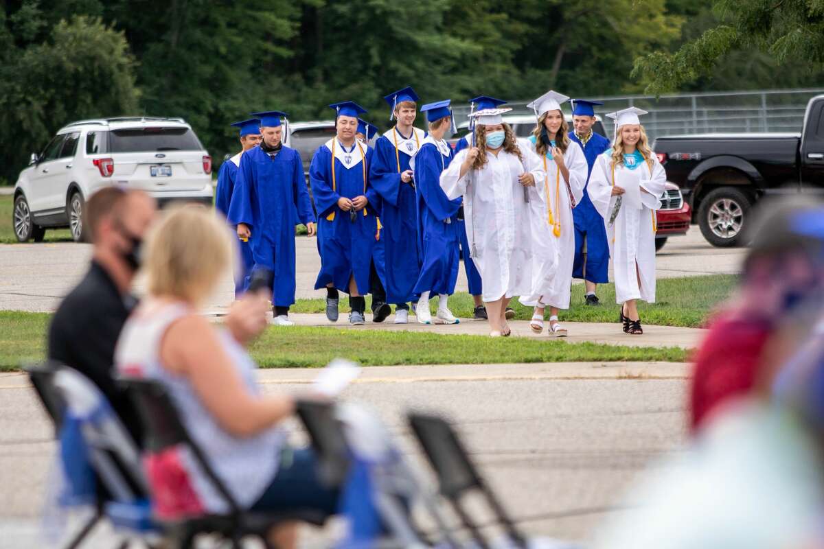 Coleman High School graduates celebrate with their family and friends during a commencement ceremony Sunday, Aug. 2, 2020 at the school. (Cody Scanlan/for the Daily News)