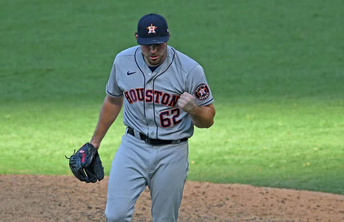 ANAHEIM, CA - AUGUST 02: Blake Taylor #62 of the Houston Astros pumps his fist after earning the win pitching in the 11th inning against the Los Angeles Angels at Angel Stadium of Anaheim on August 2, 2020 in Anaheim, California. (Photo by Jayne Kamin-Oncea/Getty Images)