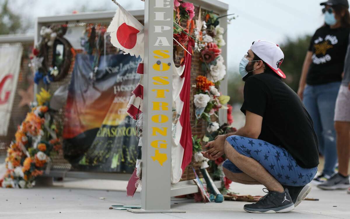 People view a temporary memorial in Ponder Park honoring victims of the Walmart shooting which left 23 people dead in a racist attack targeting Latinos on August 2, 2020 in El Paso, Texas. August 3rd marks the one-year anniversary of the deadliest attack against Hispanics in modern U.S. history. A number of memorial events are planned amid the COVID-19 pandemic in the Texas city which sits along the U.S.-Mexico border. (Photo by Mario Tama/Getty Images)