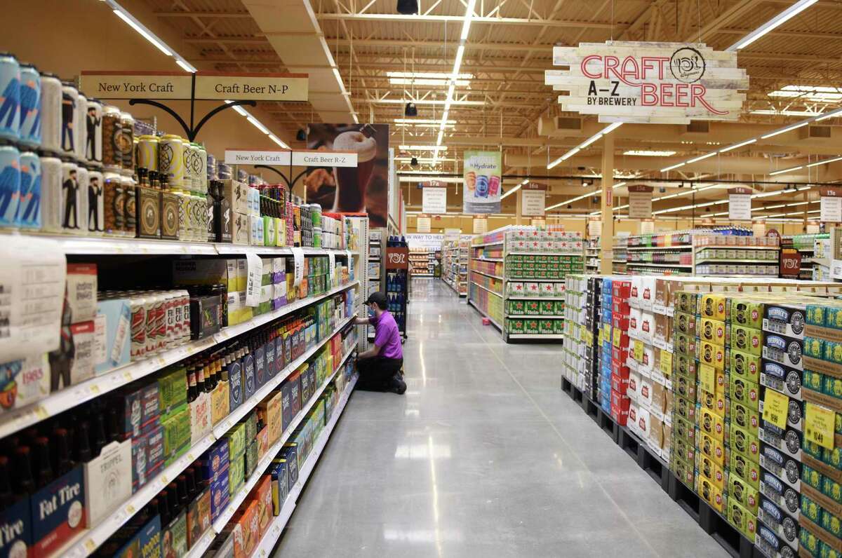 Many aisles of craft beer are stocked at the new Wegmans supermarket in Harrison, N.Y. Monday, Aug. 3, 2020. The 121,000 sq. ft. store features prepared food and restaurant options, as well as an enormous variety of groceries and household essentials. Located just off Interstate 287, Wegmans will officially open for business on Wednesday at 9 a.m.