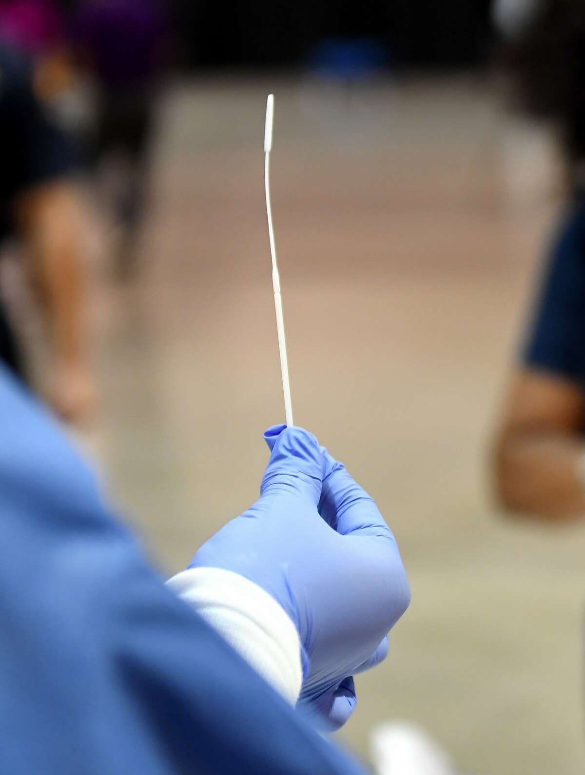 File -- A sterile cotton swab is used in testing for coronavirus (COVID-19).