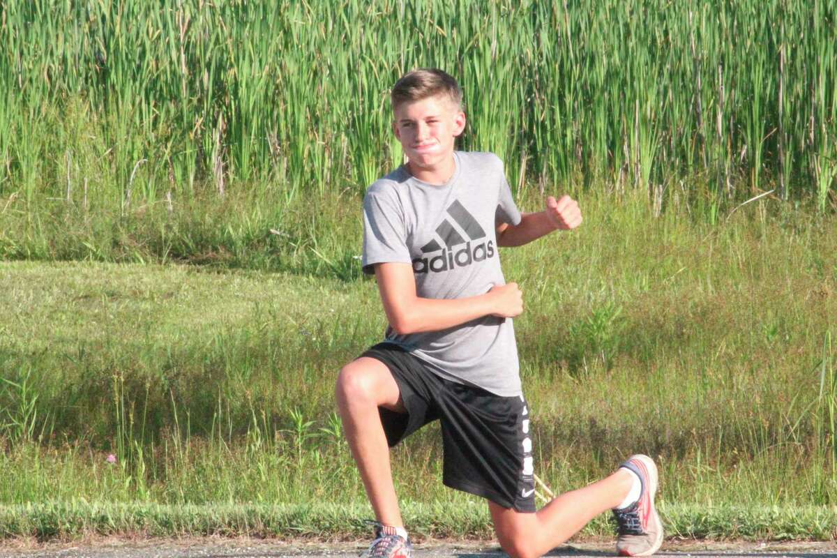 Reed City's Ty Kailing works to get into shape prior to a summer cross country run. (Pioneer photo/John Raffel)