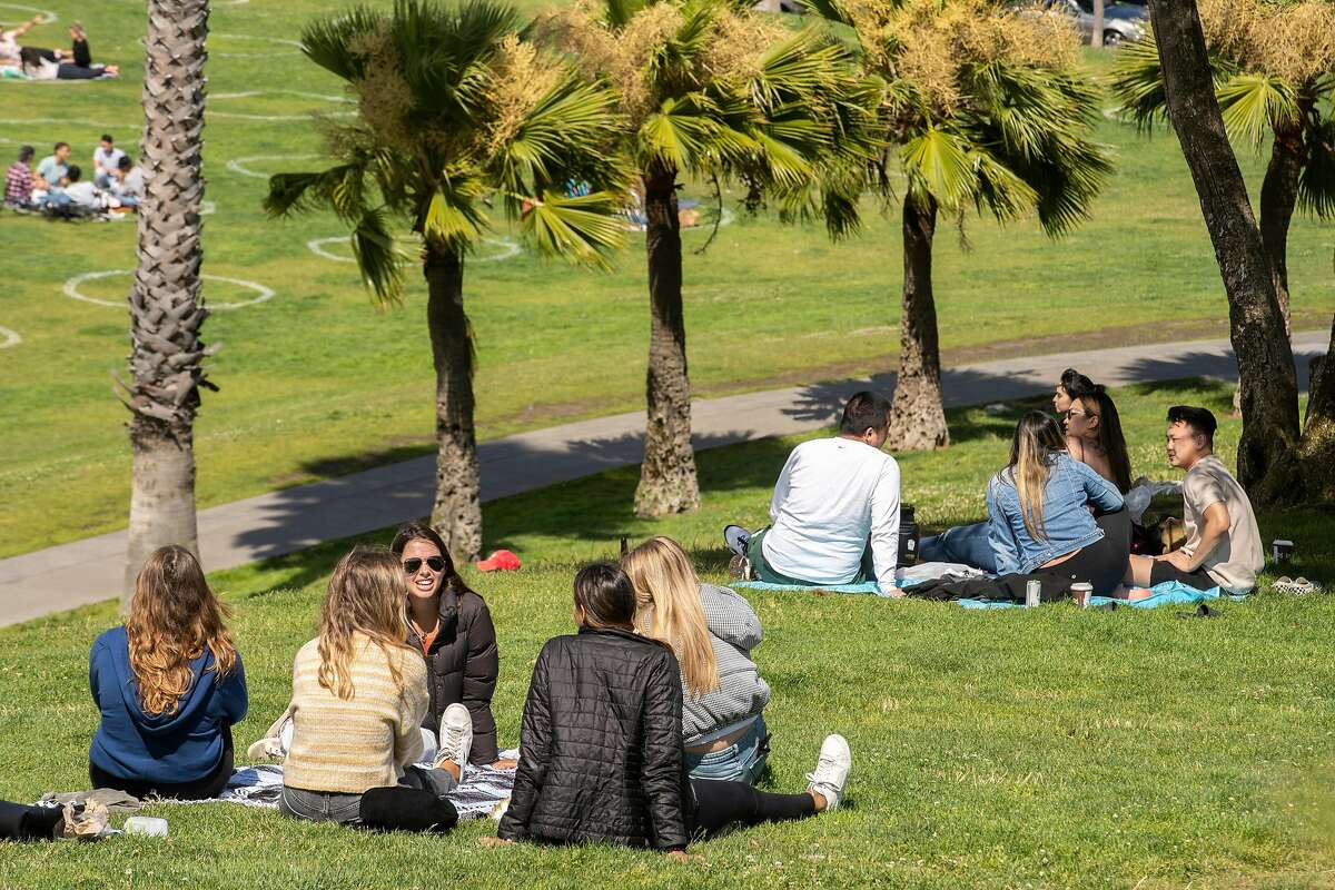 Groups of people hang out at Dolores Park on July 28, 2020, in San Francisco.
