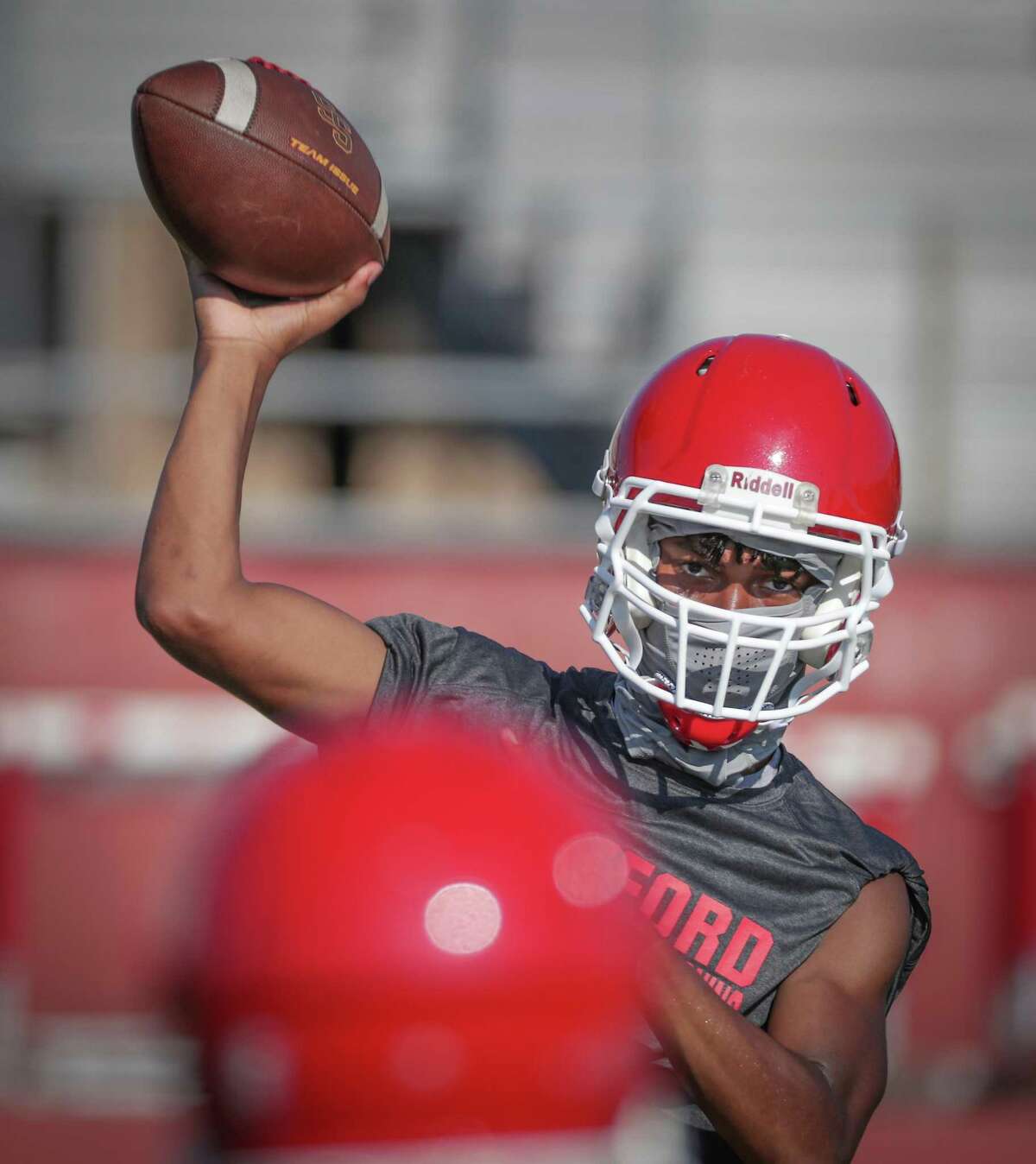Stafford High School freshman quarterback Brytan Buckner passes during the first day of high school football practice, which is only taking place at a select number of schools in the Houston area Monday, Aug. 3, 2020, in Stafford.
