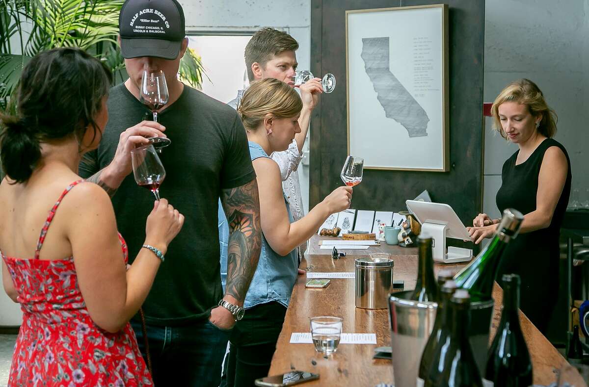 People taste wine at Broc Cellars' tasting room in Berkeley, Calif. on August 18th, 2018.