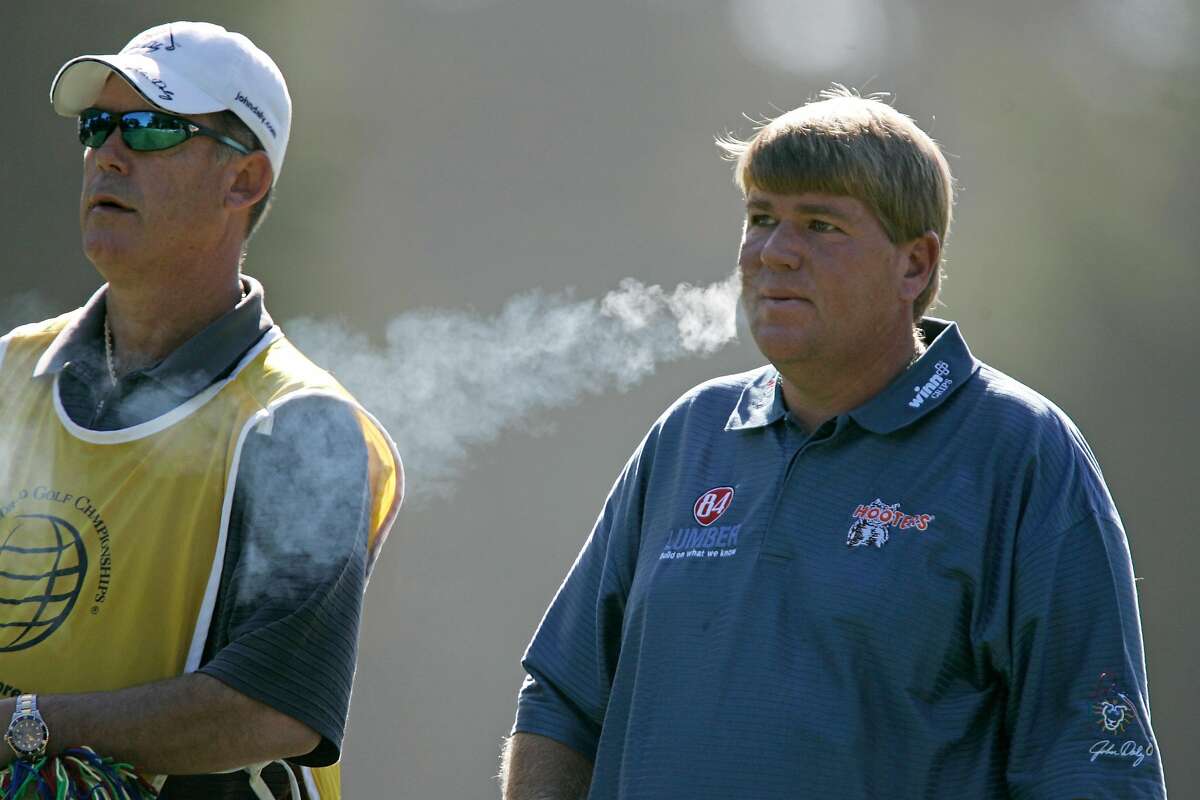 AMEXgolf_0004_db.jpg John Daly smokes as he waits for his approach shot on the 4th hole at the American Express Championship at Harding Park Golf Course. Event on 10/9/05 in San Francisco. Darryl Bush / The Chronicle Ran on: 10-10-2005 John Daly captivated the Harding gallery with smoking drives and unvarnished play. Ran on: 10-10-2005 John Daly captivated the Harding gallery with smoking drives and unvarnished play.