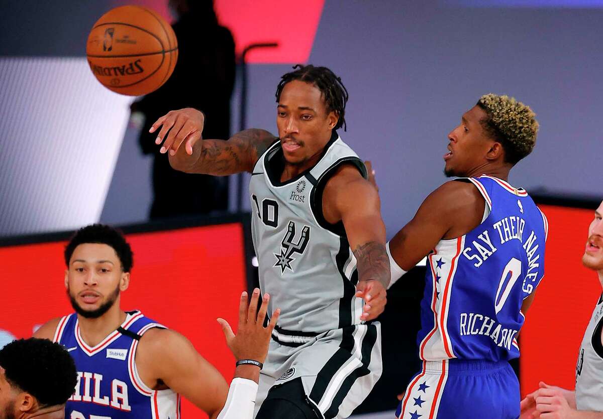 DeMar DeRozan (10), who scored a game-high 30 points, helped the Spurs rally from a 14-point, second-half deficit, but it wasn’t enough to overcome the Philadelphia 76ers on Monday in Orlando, Fla.