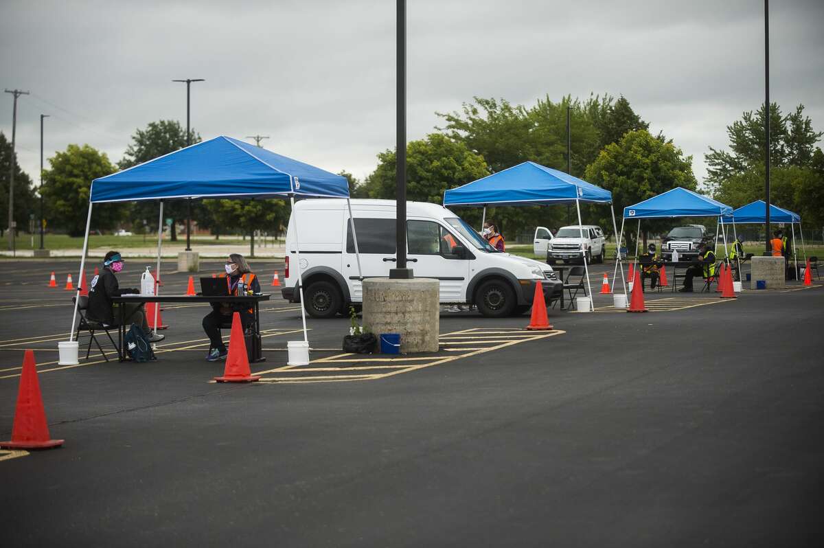 Officials with FEMA staff a documentation drop-off center Tuesday, Aug. 4, 2020 at Dow Diamond for those impacted by the May flooding to submit any required supporting documents for their disaster assistance applications. (Katy Kildee/kkildee@mdn.net)